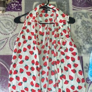 This is a small sleeveless blouse- great for the spring time to wear by itself.